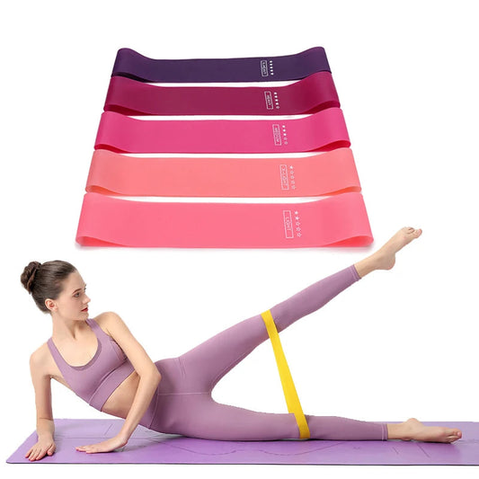 Woman exercising with resistance bands on a white background